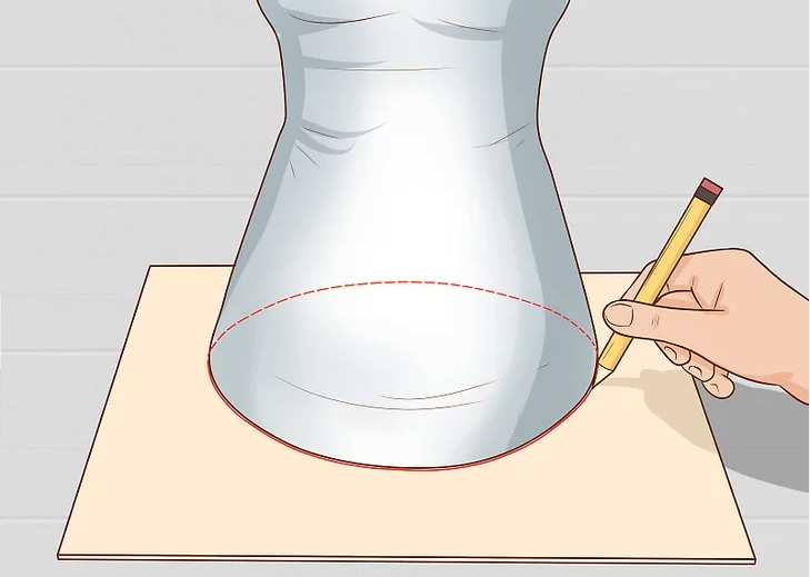 Trace the base of your mannequin onto cardboard or foam board.
