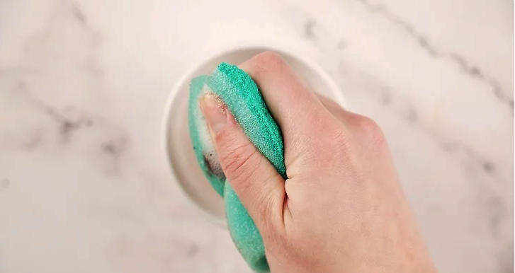 Step 2: Wipe the Exterior with a Damp Sponge